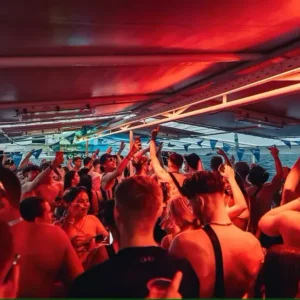 Crowd dancing under the lights at Boat Party Malta.