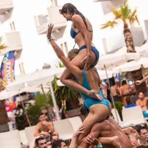 Girl lifted on shoulders during a high-energy moment at Bora Bora Pool Party Malta.