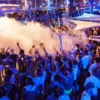 A packed pool party at Cafe Del Mar Malta, with people dancing in the water.