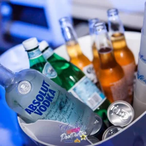 A luxurious VIP bottle service setup at Cafe Del Mar Malta, featuring premium bottles and stunning ocean views.