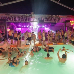 Aerial view of the Flirt Foam Party showcasing the central pool surrounded by dancing attendees at Aria Complex, Malta.