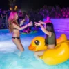Women having fun with pool floats at The Rooftop Pool Party, Gianpula Malta.