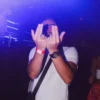 Man making the Jul rap sign at Le Classico French Party at Sky Club Malta.