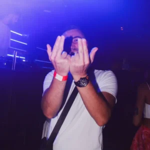 Man making the Jul rap sign at Le Classico French Party at Sky Club Malta.