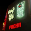 Illuminated Toy Room Malta and Pacha collaboration logo on the club's exterior facade.
