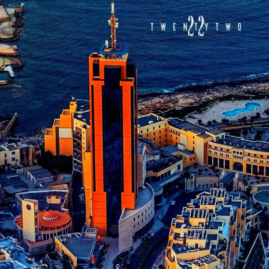 A stunning aerial view showcasing the luxurious Twenty Two Malta located at Portomaso Business Tower, overlooking the beautiful cityscape.