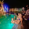 People enjoying a pool party Malta on the Hugo Hotel Malta rooftop.