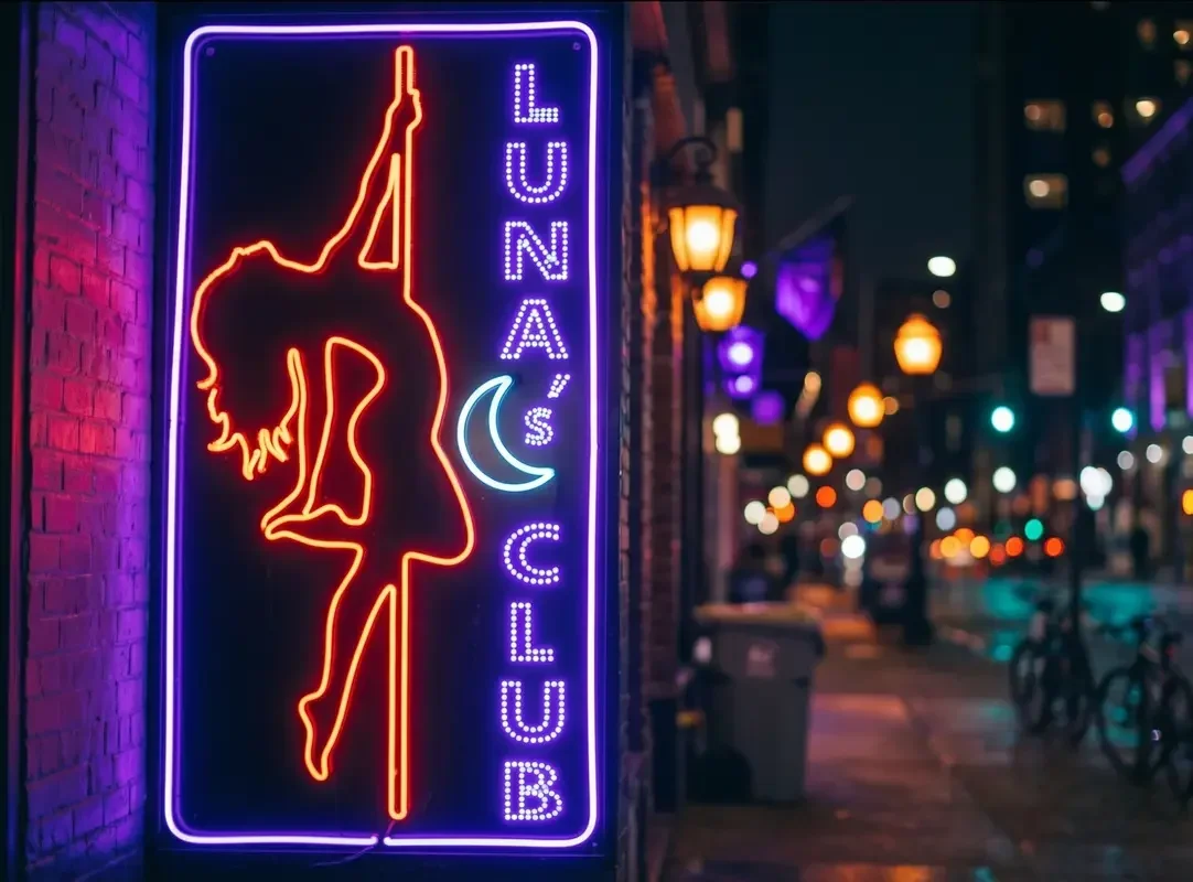 Insegna al neon di una ballerina fuori da uno strip club nel quartiere a luci rosse di Malta